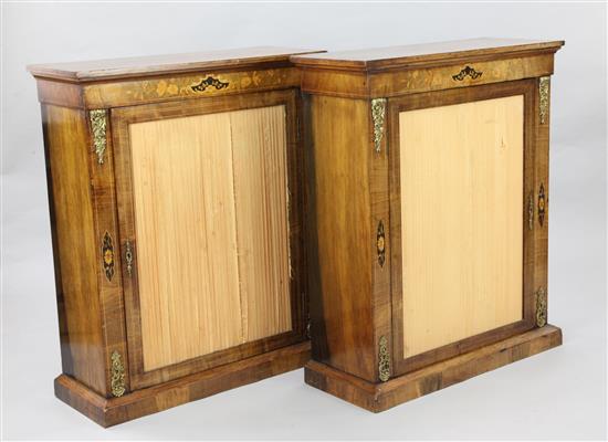 A pair of Victorian marquetry inlaid walnut pier cabinets, W.2ft 7in. D.1ft H.3ft 2in.